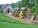 Community playground with slides and climbing structures offers fun activities for  at 5418 Amity Dr, Powder Springs, GA 30127