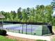 Community tennis courts enclosed by a fence offer recreational opportunities at 5418 Amity Dr, Powder Springs, GA 30127
