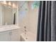 Bathroom featuring white tile, bathtub, and a sink with a vanity at 816 S Columbia Dr, Decatur, GA 30030