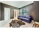 Neutral toned bedroom featuring a modern pullout couch and ensuite bathroom at 816 S Columbia Dr, Decatur, GA 30030