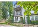 Beautiful two-story home featuring a quaint balcony, freshly painted white brick, and manicured landscaping at 816 S Columbia Dr, Decatur, GA 30030