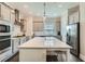 Open-concept kitchen with a large island, modern appliances, and stylish gray cabinetry at 816 S Columbia Dr, Decatur, GA 30030