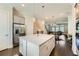 Modern kitchen featuring a large island, stainless steel appliances, and an open view of the living area at 816 S Columbia Dr, Decatur, GA 30030