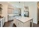 Updated kitchen featuring an island with quartz countertops, stainless steel appliances, and grey cabinets at 816 S Columbia Dr, Decatur, GA 30030