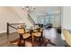 Open-concept living area with hardwood floors, glass-top dining table, and contemporary decor at 816 S Columbia Dr, Decatur, GA 30030