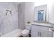 Bathroom featuring a marble tiled shower, modern toilet, and granite vanity at 909 Shiloh Ridge Nw Run, Kennesaw, GA 30144