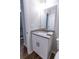 Bathroom featuring a granite vanity, modern sink, and view of the staircase at 909 Shiloh Ridge Nw Run, Kennesaw, GA 30144