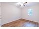 Bedroom featuring hardwood floors, a ceiling fan, and natural light from the window at 909 Shiloh Ridge Nw Run, Kennesaw, GA 30144
