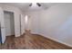 Bedroom featuring hardwood floors, a ceiling fan, a walk in closet and a door at 909 Shiloh Ridge Nw Run, Kennesaw, GA 30144