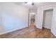Bedroom featuring hardwood floors, a ceiling fan, a walk in closet and a view to the stairs at 909 Shiloh Ridge Nw Run, Kennesaw, GA 30144