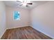 Bedroom featuring hardwood floors, a ceiling fan, and natural light from the window at 909 Shiloh Ridge Nw Run, Kennesaw, GA 30144
