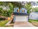 Charming two-story home with blue siding, black shutters, and a well-maintained front yard at 909 Shiloh Ridge Nw Run, Kennesaw, GA 30144