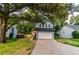 Charming two-story home with blue siding and a well-maintained front lawn and a two car garage at 909 Shiloh Ridge Nw Run, Kennesaw, GA 30144