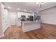 Bright kitchen with granite countertops, stainless appliances, white cabinets, and center island overlooks an open floor plan at 909 Shiloh Ridge Nw Run, Kennesaw, GA 30144