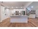 Beautiful kitchen features an island with granite countertops, stainless steel appliances, and white cabinets at 909 Shiloh Ridge Nw Run, Kennesaw, GA 30144