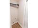Bright laundry room with convenient storage shelf at 909 Shiloh Ridge Nw Run, Kennesaw, GA 30144