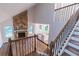 Great room featuring hardwood floors, fireplace, staircase and a view into the kitchen at 909 Shiloh Ridge Nw Run, Kennesaw, GA 30144