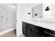 Modern bathroom with a glass-enclosed shower, sleek vanity, and contemporary fixtures, designed for style and convenience at 10862 Serenbe Ln, Chattahoochee Hills, GA 30268