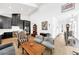 Bright open-concept living space with high ceilings, featuring a modern kitchen and comfortable seating area at 10862 Serenbe Ln, Chattahoochee Hills, GA 30268