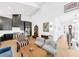 Bright open-concept living space with high ceilings, featuring a modern kitchen and comfortable seating area at 10862 Serenbe Ln, Chattahoochee Hills, GA 30268