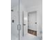 Bathroom with glass shower, white tile, and modern fixtures at 1534 River Rock Trce, Woodstock, GA 30188