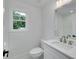 Bathroom featuring vanity, sink, toilet at 1534 River Rock Trce, Woodstock, GA 30188