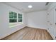 Bedroom with hardwood floors, window, and closet at 1534 River Rock Trce, Woodstock, GA 30188