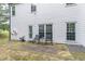 Backyard patio with seating, perfect for outdoor relaxation and entertaining at 3906 Elm Trace Ct, Loganville, GA 30052
