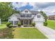 Charming two-story home featuring a well-manicured lawn and traditional design elements at 3906 Elm Trace Ct, Loganville, GA 30052
