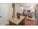 View of kitchen island flowing into the living and dining room at 3906 Elm Trace Ct, Loganville, GA 30052