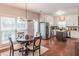 Eat-in kitchen with stainless steel appliances, granite countertops, and hardwood floors at 3906 Elm Trace Ct, Loganville, GA 30052