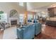 Open-concept living room with fireplace, large windows, hardwood floors, and ample natural light at 3906 Elm Trace Ct, Loganville, GA 30052