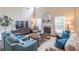 Bright living room with fireplace, large windows, hardwood floors, and comfortable seating at 3906 Elm Trace Ct, Loganville, GA 30052