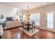 Open living space with hardwood floors, a fireplace, and views of the surrounding neighborhood at 3906 Elm Trace Ct, Loganville, GA 30052