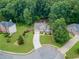 Aerial view of a home showcasing its well-manicured lawn, landscaping, and backyard at 4204 Woodfare Nw Ln, Kennesaw, GA 30152