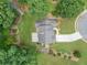 Stunning aerial view of a landscaped property featuring lush greenery, garden, and a driveway at 4204 Woodfare Nw Ln, Kennesaw, GA 30152