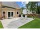 Spacious backyard with patio area, green lawn, and manicured landscaping at 4204 Woodfare Nw Ln, Kennesaw, GA 30152