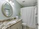 Bathroom with granite counters, a brushed nickel faucet, and updated fixtures at 4204 Woodfare Nw Ln, Kennesaw, GA 30152