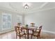 Cozy dining room featuring elegant lighting and a dining table with seating for four at 4204 Woodfare Nw Ln, Kennesaw, GA 30152