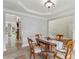 Dining room showcasing tray ceilings, chandelier, and access to other living spaces at 4204 Woodfare Nw Ln, Kennesaw, GA 30152