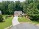 Charming two-story home with a manicured lawn, mature trees, and a three car garage at 4204 Woodfare Nw Ln, Kennesaw, GA 30152