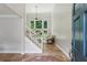 Bright foyer with tiled floors, staircase, and views into the living area at 4204 Woodfare Nw Ln, Kennesaw, GA 30152