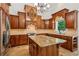 Spacious kitchen featuring a central island, granite countertops, custom cabinetry, and modern appliances at 4204 Woodfare Nw Ln, Kennesaw, GA 30152