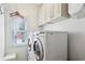 Laundry room with front loading washer and dryer and window at 4204 Woodfare Nw Ln, Kennesaw, GA 30152