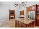 Open concept living room featuring a fireplace, kitchen, and hardwood tile flooring at 4204 Woodfare Nw Ln, Kennesaw, GA 30152
