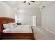 Bright main bedroom featuring tray ceilings, soft carpet, and decorative furniture at 4204 Woodfare Nw Ln, Kennesaw, GA 30152