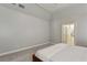 Bright main bedroom featuring tray ceilings, soft carpet, and ensuite bathroom access at 4204 Woodfare Nw Ln, Kennesaw, GA 30152