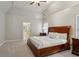 Bright main bedroom featuring tray ceilings, soft carpet, and ensuite bathroom at 4204 Woodfare Nw Ln, Kennesaw, GA 30152