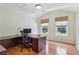 Comfortable office space featuring hardwood floors, a desk, and natural light from windows at 4204 Woodfare Nw Ln, Kennesaw, GA 30152
