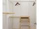 Custom walk-in closet features adjustable shelving and drawer systems at 4204 Woodfare Nw Ln, Kennesaw, GA 30152